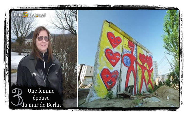 Une femme épouse du mur de Berlin